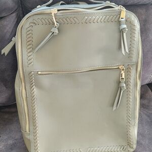 Stylish Gray Backpack with Gold Accents